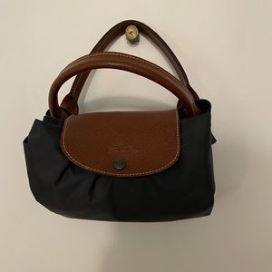 Charcoal gray longchamp carry on luggage/weekender bag.  Lightly used.